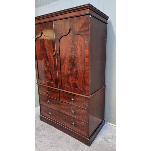 1066 - A 19th century mahogany linen press, enclosing five trays, 126cm wide.  