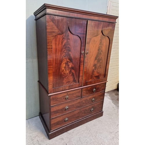 1066 - A 19th century mahogany linen press, enclosing five trays, 126cm wide.  