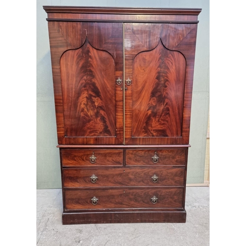 1066 - A 19th century mahogany linen press, enclosing five trays, 126cm wide.  