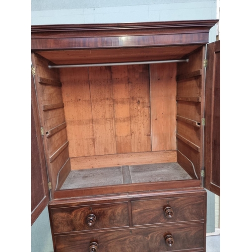 1067 - A George III mahogany linen press, 121cm wide. 