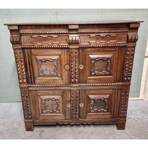 1070 - An antique Continental walnut and oak side cabinet, with moulded decoration, 119cm wide.... 