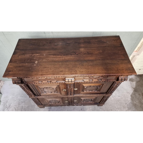 1070 - An antique Continental walnut and oak side cabinet, with moulded decoration, 119cm wide.... 