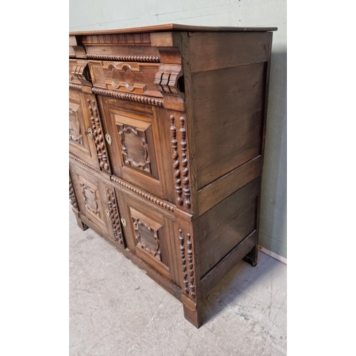 1070 - An antique Continental walnut and oak side cabinet, with moulded decoration, 119cm wide.... 