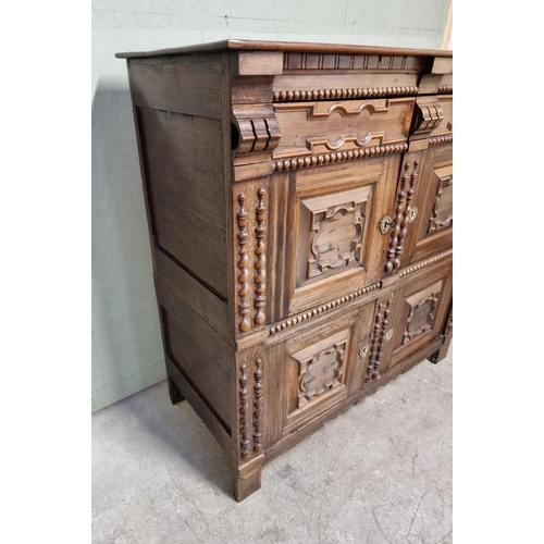 1070 - An antique Continental walnut and oak side cabinet, with moulded decoration, 119cm wide.... 