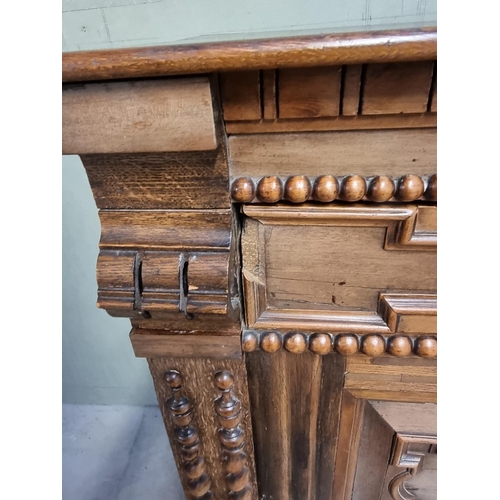 1070 - An antique Continental walnut and oak side cabinet, with moulded decoration, 119cm wide.... 