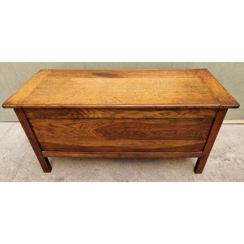 1072 - A reproduction oak linenfold coffer, 106.5cm wide. 