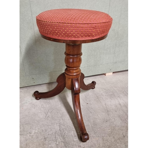 1074 - A Victorian mahogany adjustable piano stool.