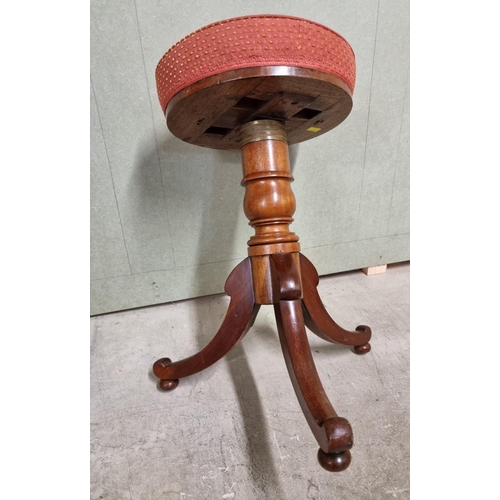 1074 - A Victorian mahogany adjustable piano stool.