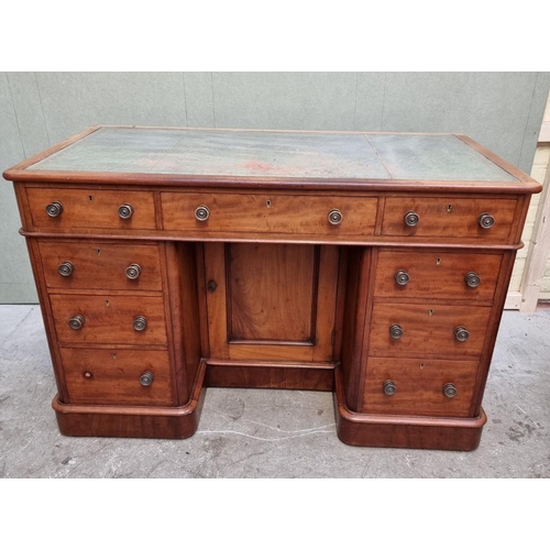 1080 - A late Victorian mahogany pedestal desk, with kneehole cupboard, 120.5cm wide.  ... 