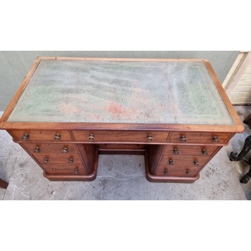 1080 - A late Victorian mahogany pedestal desk, with kneehole cupboard, 120.5cm wide.  ... 