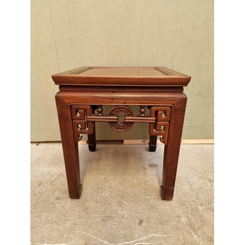 1085 - A Chinese carved hardwood low occasional table, 54cm high x 46.5cm wide. 