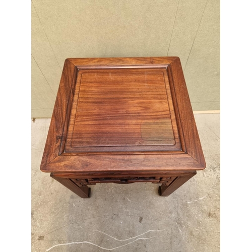 1085 - A Chinese carved hardwood low occasional table, 54cm high x 46.5cm wide. 