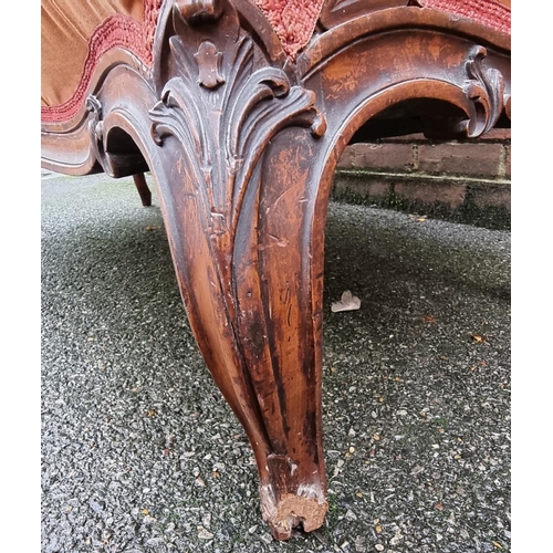 1088 - A Victorian carved walnut and button upholstered settee, (faults).