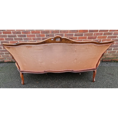 1088 - A Victorian carved walnut and button upholstered settee, (faults).