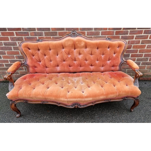 1088 - A Victorian carved walnut and button upholstered settee, (faults).