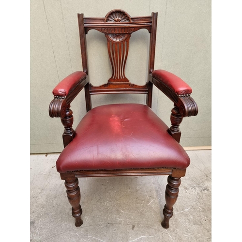 1092 - A good circa 1900 carved mahogany and red leather desk chair. 