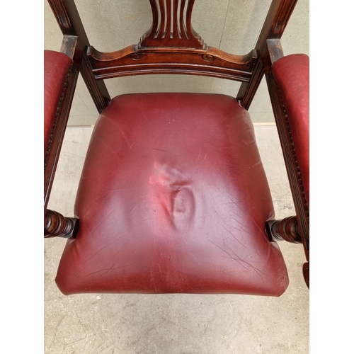 1092 - A good circa 1900 carved mahogany and red leather desk chair. 