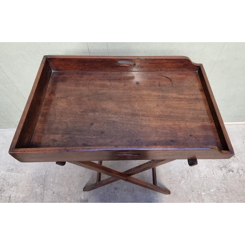 1097 - A George III mahogany butler's tray, 78cm wide, on folding stand.