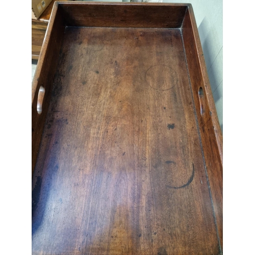 1097 - A George III mahogany butler's tray, 78cm wide, on folding stand.