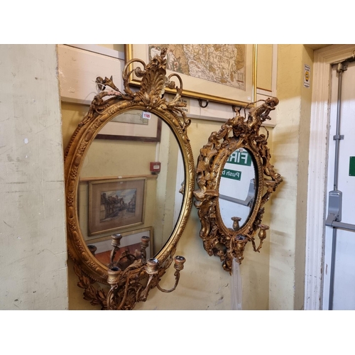 1105 - Two antique giltwood framed girandoles, largest 100 x 56cm.