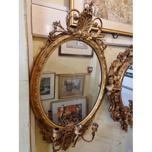 1105 - Two antique giltwood framed girandoles, largest 100 x 56cm.