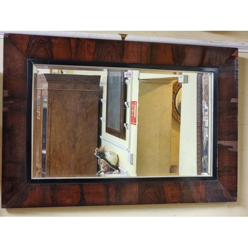 1111 - A 19th century rosewood framed rectangular wall mirror, 67 x 98.5cm. 