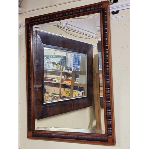 1111 - A 19th century rosewood framed rectangular wall mirror, 67 x 98.5cm. 