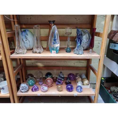 1122 - A collection of clear and coloured glass, to include paperweights. (two shelves)