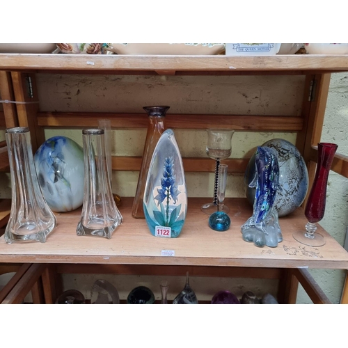 1122 - A collection of clear and coloured glass, to include paperweights. (two shelves)