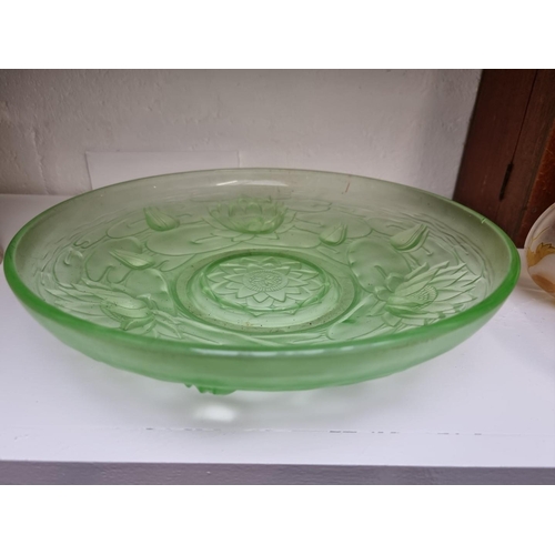 1167 - A 1930s green glass dish, 33cm diameter; together with an acid etched goblet, 16cm high. (2)... 