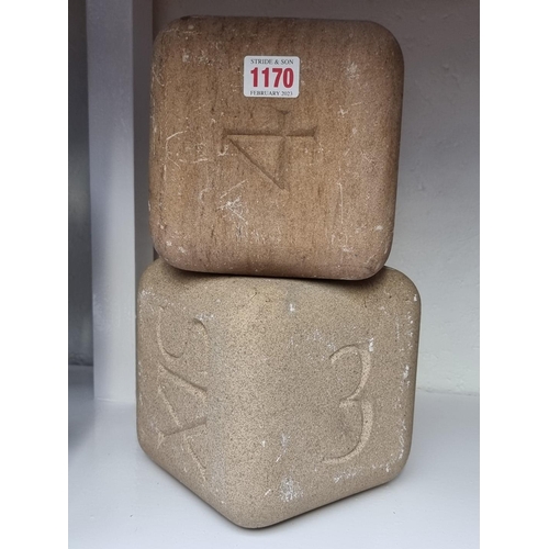 1170 - A pair of novelty stone dice, 15cm. 