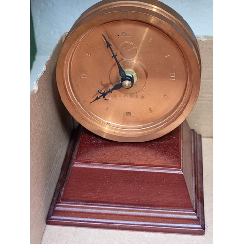 1177 - Three vintage timepieces and an aneroid barometer. 