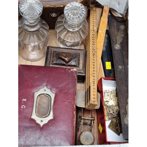 1190 - A mixed lot, to include: a pair of cut glass decanters and stoppers; and a cased pair of binoculars.... 