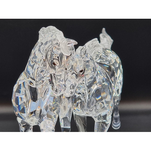 1214 - Swarovski: 'The Wild Horses' figure group, number 25/10,000, boxed with stand, certificate etc.... 