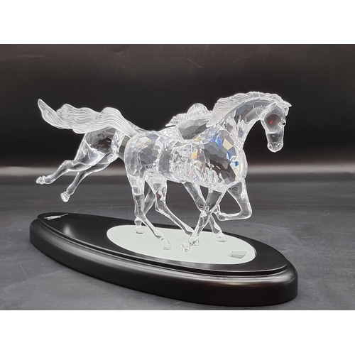 1214 - Swarovski: 'The Wild Horses' figure group, number 25/10,000, boxed with stand, certificate etc.... 