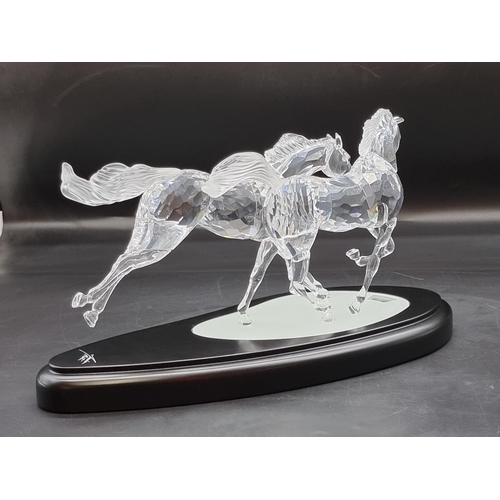 1214 - Swarovski: 'The Wild Horses' figure group, number 25/10,000, boxed with stand, certificate etc.... 