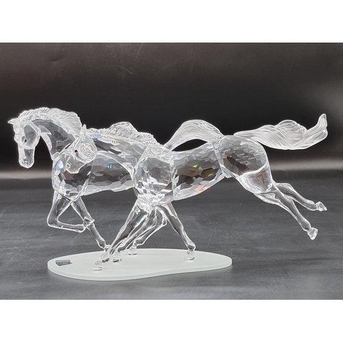 1214 - Swarovski: 'The Wild Horses' figure group, number 25/10,000, boxed with stand, certificate etc.... 