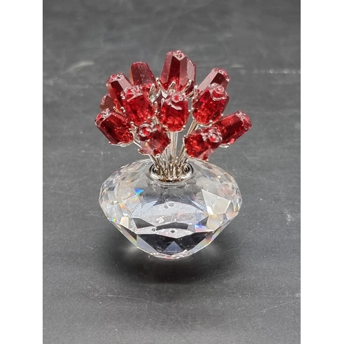 1229 - Swarovski: a 2002 Jubilee Edition 'The Vase of Roses', with certificate; together with a beetle bott... 