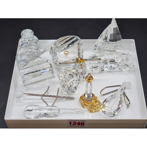 1246 - Swarovski: a mixed group of objects, to include piano and stool; motorcar; sailing boat; windmill et... 