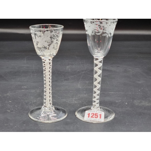 1251 - Two 18th century opaque air twist wine glasses, each with etched bowl, largest 15.5cm high, (ch... 