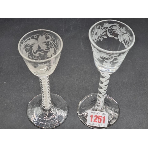 1251 - Two 18th century opaque air twist wine glasses, each with etched bowl, largest 15.5cm high, (ch... 