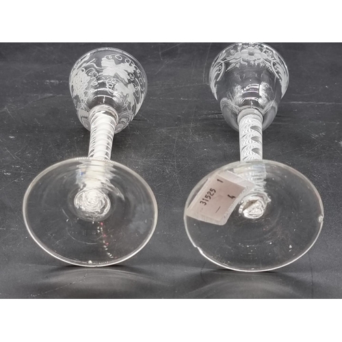 1251 - Two 18th century opaque air twist wine glasses, each with etched bowl, largest 15.5cm high, (ch... 