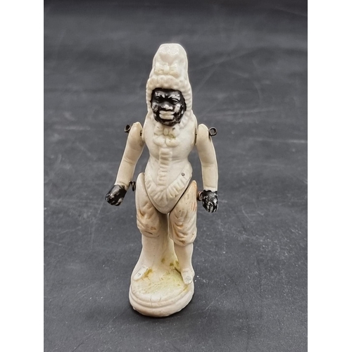 1252 - A scarce and unusual bisque porcelain figure of an African American black figure, inscribed 'Patent'... 