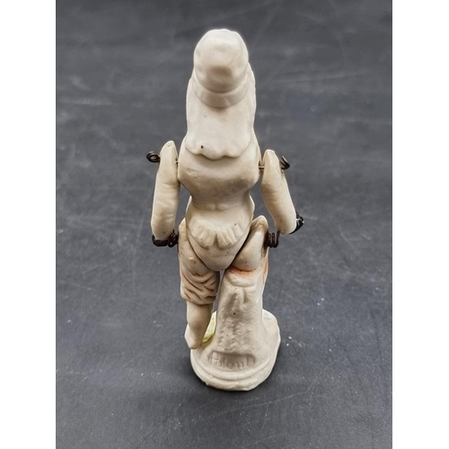 1252 - A scarce and unusual bisque porcelain figure of an African American black figure, inscribed 'Patent'... 