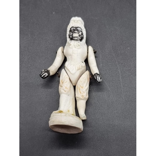 1252 - A scarce and unusual bisque porcelain figure of an African American black figure, inscribed 'Patent'... 