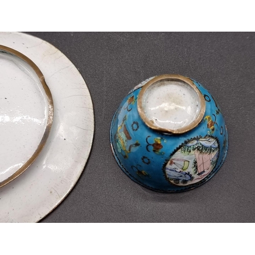 1254 - A small Chinese canton enamel wine bowl and saucer, 18th century, painted with landscape panels... 