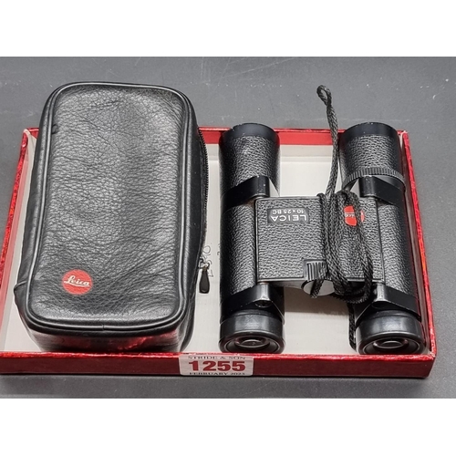 1255 - A pair of Leica 10x25 BC binoculars, in leather case.