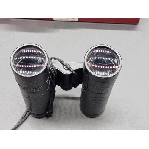 1255 - A pair of Leica 10x25 BC binoculars, in leather case.