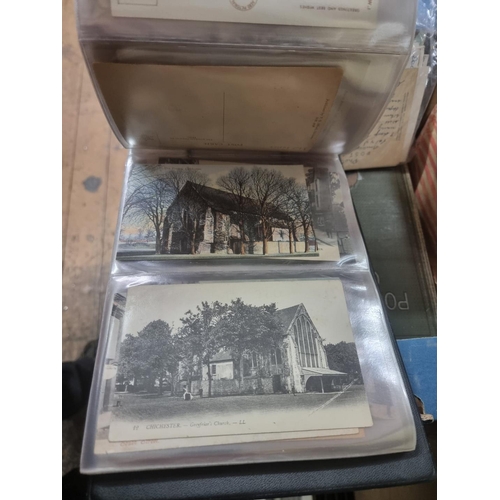 1309 - Postcards: an album of Chichester; together with another old album, to include World War I; and othe... 