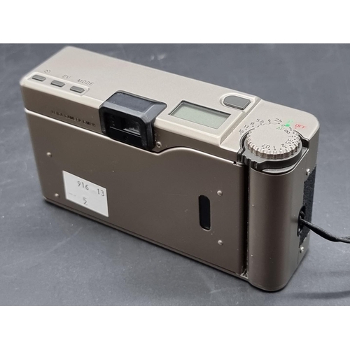 1327 - Camera: a Leica Minilux film camera, with leather case.